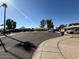 A view of the street, showing a quiet residential neighborhood with several parked cars at 1954 W Kerry Ln, Phoenix, AZ 85027