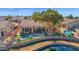 A beautiful house with a private pool and pond frontage from a bird's-eye view at 2029 N 109Th Ave, Avondale, AZ 85392