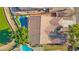 A beautiful aerial view of a home with a private pool, landscaped yard, and lovely tile roof at 2029 N 109Th Ave, Avondale, AZ 85392