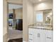 Bathroom with white cabinets and granite countertops at 2029 N 109Th Ave, Avondale, AZ 85392