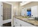 Well-lit bathroom showcases a stylish vanity with a decorative mirror at 2029 N 109Th Ave, Avondale, AZ 85392