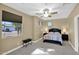 Light-filled bedroom with window and complete with a bed and matching nightstands at 2029 N 109Th Ave, Avondale, AZ 85392