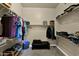 Spacious walk-in closet offers ample shelving and a comfortable seating area at 2029 N 109Th Ave, Avondale, AZ 85392