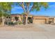 Charming single-story home with mature landscaping and a two-car garage at 2029 N 109Th Ave, Avondale, AZ 85392