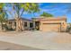 Charming single-story home with mature landscaping and a two-car garage at 2029 N 109Th Ave, Avondale, AZ 85392