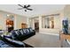 Spacious living room featuring neutral tones, plush carpeting, and an open layout at 2029 N 109Th Ave, Avondale, AZ 85392