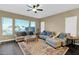 Comfortable living room with plush seating, natural light, and a stylish rug at 2029 N 109Th Ave, Avondale, AZ 85392