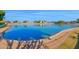 Panoramic view of a serene community pond, offering peaceful waterfront living at 2029 N 109Th Ave, Avondale, AZ 85392