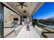 Covered patio with seating area that offers seamless access to the outdoor space and pool at 2046 N Red Clf, Mesa, AZ 85207