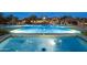 Beautiful swimming pool featuring a fountain, and well-lit, clear water for night swimming at 2046 N Red Clf, Mesa, AZ 85207