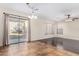 Cozy dining area with tile floors, modern lighting, and sliding glass door to patio at 2406 W Tallgrass Trl, Phoenix, AZ 85085