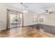 Cozy dining area with tile floors, modern lighting, and sliding glass door to patio at 2406 W Tallgrass Trl, Phoenix, AZ 85085