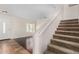 Inviting entryway features staircase and seamlessly connects living spaces with stylish flooring at 2406 W Tallgrass Trl, Phoenix, AZ 85085