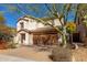 Attractive two-story home with desert landscaping, a tiled roof, and a two-car garage at 2406 W Tallgrass Trl, Phoenix, AZ 85085