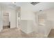 Upstairs hallway with neutral carpeting, providing access to other rooms in the house at 2406 W Tallgrass Trl, Phoenix, AZ 85085