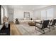 Bright living room with layered rugs and natural-colored sectional at 2723 S 357Th Dr, Tonopah, AZ 85354