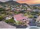 Expansive aerial view of the property showcasing the backyard entertainment area and desert surroundings at 28826 N 67Th Dr, Peoria, AZ 85383