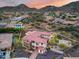 Stunning aerial view of the property featuring a backyard oasis, lush landscaping, and mountain views at 28826 N 67Th Dr, Peoria, AZ 85383