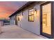 Exterior view of a balcony with outdoor lighting, and access to the bathroom at 28826 N 67Th Dr, Peoria, AZ 85383