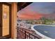 Beautiful balcony view overlooking neighboring houses and desert landscaping under a dramatic sunset at 28826 N 67Th Dr, Peoria, AZ 85383