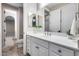 Bathroom featuring vanity with framed mirror, tile floor and a doorway to another room at 28826 N 67Th Dr, Peoria, AZ 85383