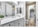 Bathroom featuring a large mirror, white cabinets and tiled floors at 28826 N 67Th Dr, Peoria, AZ 85383