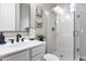 Bathroom featuring a white vanity with black fixtures and a glass shower enclosure at 28826 N 67Th Dr, Peoria, AZ 85383