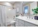 Well-lit bathroom with a shower/tub combo, white vanity, and decorative accents at 28826 N 67Th Dr, Peoria, AZ 85383