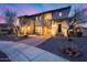 Charming exterior of a two-story home featuring desert landscaping, stone accents, and a brick-paved walkway at 28826 N 67Th Dr, Peoria, AZ 85383