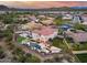 Aerial view of a home showcasing an outdoor pool, outdoor living area, basketball court, and putting green at 28826 N 67Th Dr, Peoria, AZ 85383