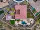 Overhead view of rear of home showing the pool, pergolas, outdoor living space and sport court at 28826 N 67Th Dr, Peoria, AZ 85383