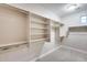 Walk-in closet with shelving, hanging rods and window for ample storage at 28826 N 67Th Dr, Peoria, AZ 85383