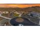 Aerial view of a luxury home in cul-de-sac with lush desert landscaping and convenient circular driveway at 297 W Chase St, San Tan Valley, AZ 85143