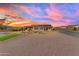 Backyard view showcasing a pool, outdoor kitchen, and spacious yard perfect for entertaining at 297 W Chase St, San Tan Valley, AZ 85143