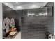 Contemporary bathroom featuring a spacious walk-in shower with black subway tile and modern fixtures at 297 W Chase St, San Tan Valley, AZ 85143