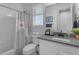 Well-lit bathroom with modern fixtures, a shower-tub combo, and a stylish vanity at 297 W Chase St, San Tan Valley, AZ 85143