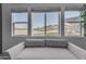 Bedroom features a seating area, natural light and desert views at 297 W Chase St, San Tan Valley, AZ 85143