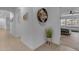 Hallway leads to bedroom; features wood-look floors and decorative accents at 297 W Chase St, San Tan Valley, AZ 85143