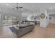 Spacious living room with modern decor flowing into an open kitchen and dining area at 297 W Chase St, San Tan Valley, AZ 85143