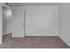 Bright bedroom featuring neutral carpet and a large closet at 330 W Northern Ave, Coolidge, AZ 85128