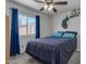 Cozy bedroom with blue accents and a ceiling fan at 330 W Northern Ave, Coolidge, AZ 85128