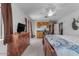 Large bedroom featuring a ceiling fan and adjacent kitchenette at 330 W Northern Ave, Coolidge, AZ 85128