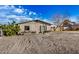 Charming single-story home showcasing a gravel front yard, cozy front porch and neutral color palette at 330 W Northern Ave, Coolidge, AZ 85128