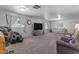 Spacious living room featuring carpet flooring, and natural light coming in from the windows at 330 W Northern Ave, Coolidge, AZ 85128