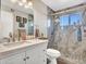 Modern bathroom featuring a sleek vanity and a glass-enclosed shower, combining style and functionality at 3328 W Charter Oak Rd, Phoenix, AZ 85029