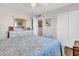 Well-lit bedroom with a view to the closet and a spacious closet, designed for relaxation and convenience at 3328 W Charter Oak Rd, Phoenix, AZ 85029