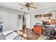 Bright bedroom featuring a ceiling fan, closet, and wood-look floors at 3328 W Charter Oak Rd, Phoenix, AZ 85029