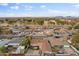 Extensive aerial view showcases a neighborhood with tree-lined streets, houses, and community spaces at 3331 W Sells Dr, Phoenix, AZ 85017