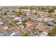 Wide aerial shot captures a residential area with houses, streets, and a nearby park, highlighting the community at 3331 W Sells Dr, Phoenix, AZ 85017