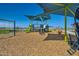 Enjoy the community playground with swings and slides under a shaded canopy at 3382 E Saddletree Way, San Tan Valley, AZ 85140